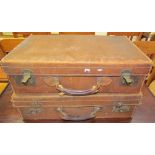 An Army & Navy leather suitcase together with another leather suitcase
