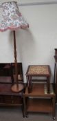 A teak and tiled top tea trolley together with a nest of two tiled topped tables and a teak