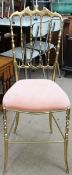 A Chiavari style solid brass chair with a pad upholstered seat