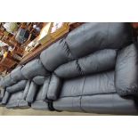 A Black leather three piece suite comprising a three seater settee,