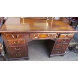 A 20th century walnut desk,