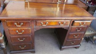 A 20th century walnut desk,