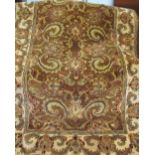 An Indian gold ground rug