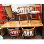 A pine kitchen table and four chairs