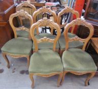 A set of six Victorian style balloon back dining chairs