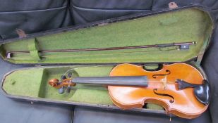 A violin, with a one piece back, bears a label "Dulcis et Fortis", with a bow, cased,