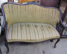 An Edwardian mahogany two seater settee,