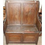 A 19th century provincial pine box settle, with a panelled back and box base (possibly Welsh),