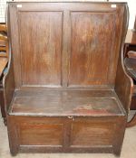 A 19th century provincial pine box settle, with a panelled back and box base (possibly Welsh),