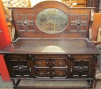 A 20th century oak mirrorback sideboard,