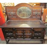 A 20th century oak mirrorback sideboard,