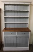 A pine dresser, painted in white and grey,