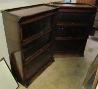 A pair of three section oak sectional bookcases with up and over glass doors
