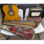 A tin hat box together with a Roberts Radio,