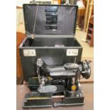 A Singer 222k sewing machine,