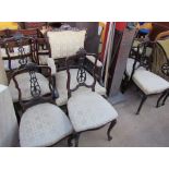 An Edwardian mahogany part salon suite, comprising a Gentleman's chair,