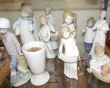 Assorted Lladro and Nao figures including Choristers,