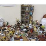 Assorted pottery and glass cats and other animals together with hardstone fruits, Onyx elephants,
