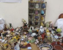 Assorted pottery and glass cats and other animals together with hardstone fruits, Onyx elephants,