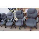 A set of four fabric upholstered office chairs
