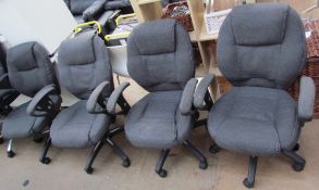 A set of four fabric upholstered office chairs