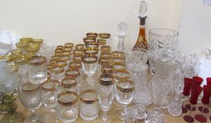 A white metal topped and flash glass decanter together with assorted gilt metal mounted drinking
