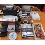 A Canon video camera together with two Roberts radios, Ikasu portable DVD player, ITT recorder,