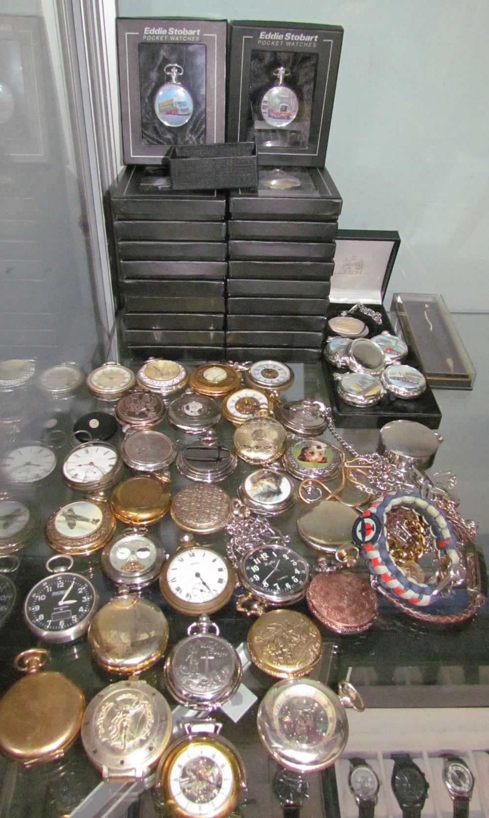 A large collection of Eddie Stobart boxed pocket watches together with other modern pocket watches