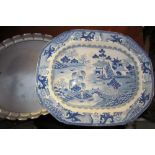 A Blue and white meat plate with oriental figures on a bridge together with a white metal tray