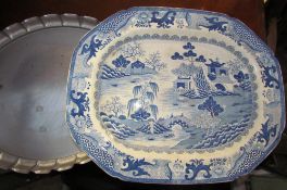 A Blue and white meat plate with oriental figures on a bridge together with a white metal tray