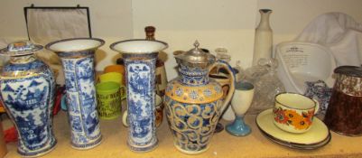 A Garniture of three Chinese porcelain vases, together with a silver topped jug,