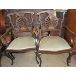 A pair of Edwardian mahogany marquetry decorated elbow chairs,