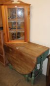 An oak gate leg dining table together with a pine hanging corner cupboard with doll's house