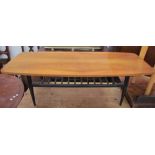 A teak and ebonised coffee table