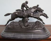 After E Loiscay A bronze model of two race horses on a marble base