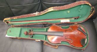 A child's violin with a one piece back bears a label "E.J.