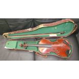 A child's violin with a one piece back bears a label "E.J.