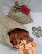 Two bags of uncirculated pennies, one 1967, the other with a lead seal and label dated 28 Oct.