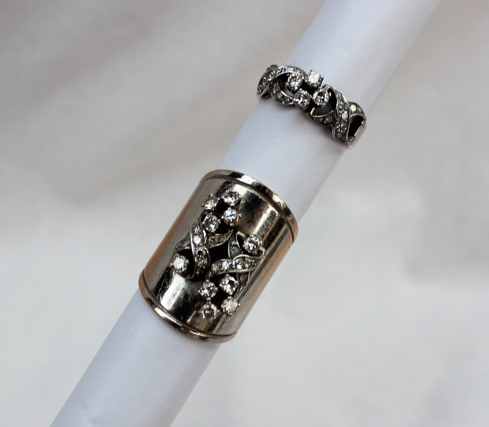 A diamond set ring, set with round old brilliant cut diamonds to a white metal setting and shank,