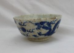 A Chinese porcelain crackle glaze pedestal bowl, decorated with dragons chasing pearls,