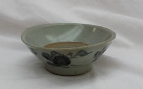 A Chinese pre 19th century stoneware bowl of flared form decorated with stylised flowerheads, 12.