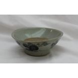 A Chinese pre 19th century stoneware bowl of flared form decorated with stylised flowerheads, 12.