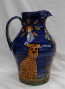 A Gwili pottery jug, painted with a tower of leopards, signed Chris Latter,