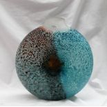 A Kosta Boda glass vase of circular form, applied with a fish to a mottled blue and red ground,
