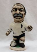 A John Hughes pottery Grogg of Jimmy Greaves in a Tottenham shirt with his foot raised on a ball,