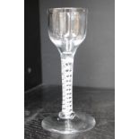 An 18th century English wine glass with a tapering bowl and double helix cotton twist on a