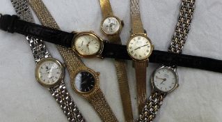 An 18ct yellow gold lady's wristwatch the circular silvered dial with baton inscribed reusser on an