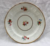 A Swansea porcelain plate of circular form, with a basket weave and swirling decoration,