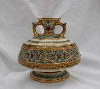 A Royal Worcester reticulated Persian style twin handled vase, in two sections,