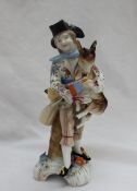 A Meissen figure of a gentleman in a tricorn hat with a goat under his arm on a trefoil base,